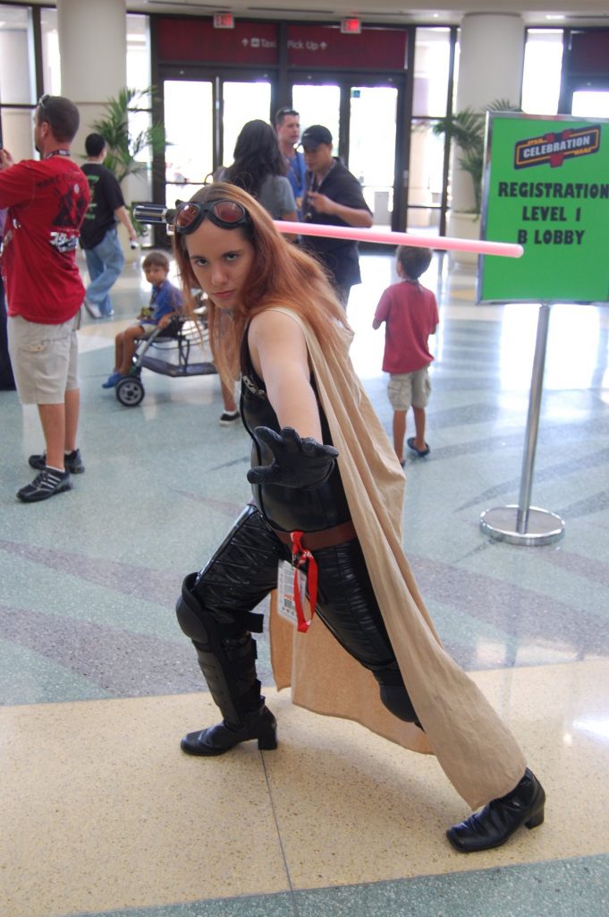 Cosplayer dressed as Mara Jade in a black jumpsuit at Star Wars Celebration V