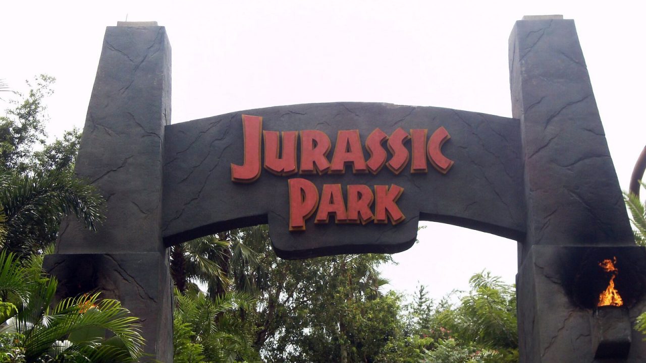 The Jurassic Park entrance arch with torches at Universal's Islands of Adventure