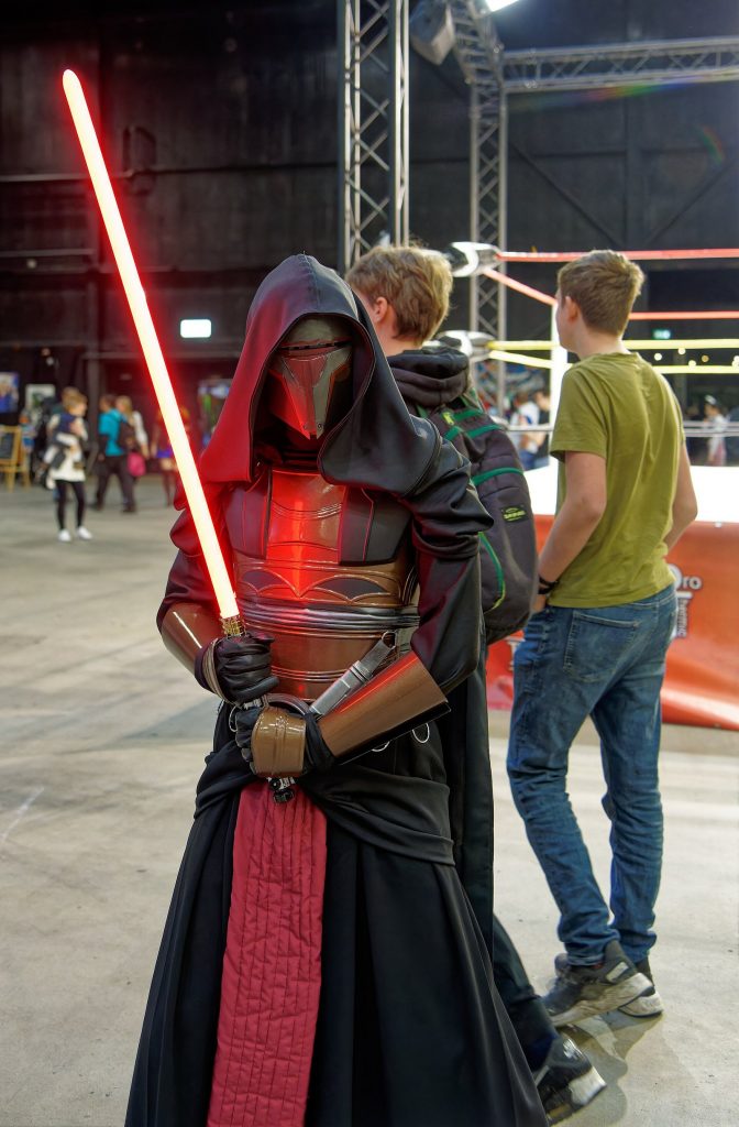 Cosplayer dressed as Darth Revan in mask and hooded robes at Comiccon Holland 2023